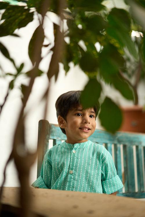 ‘Barefoot Boy’ mandarin collar hand block printed malmal cotton unisex full sleeve summer shirt in blue with white polka dots for boys and girls