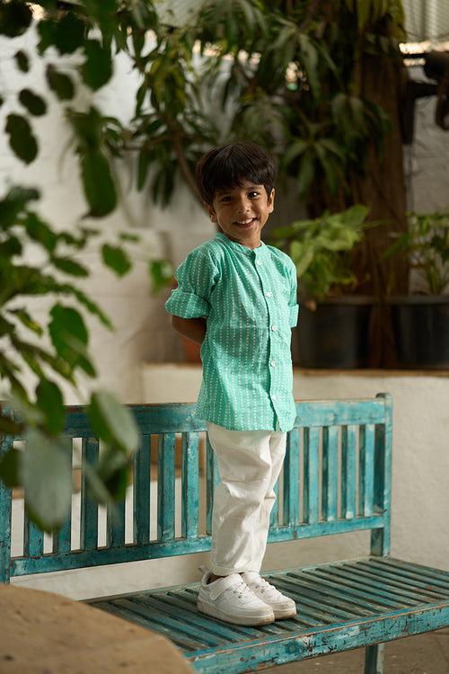 ‘Barefoot Boy’ mandarin collar hand block printed malmal cotton unisex full sleeve summer shirt in blue with white polka dots for boys and girls