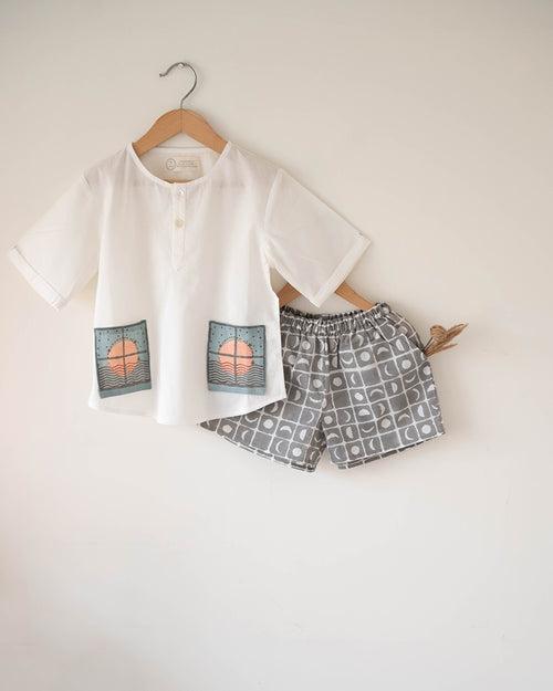 ‘Sleepover Party’ unisex kids set with patch pocket kurta and shorts in grey moon chase hand block print