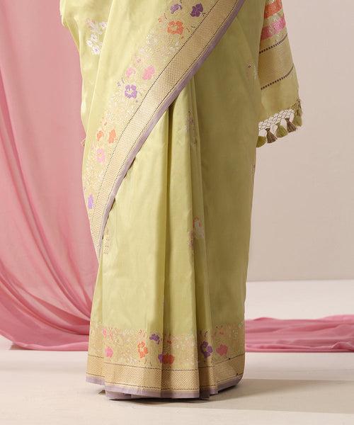 Handloom Light Green Pure Katan Silk Banarasi Saree With Floral Meenakari Border And Lilac Selvedge