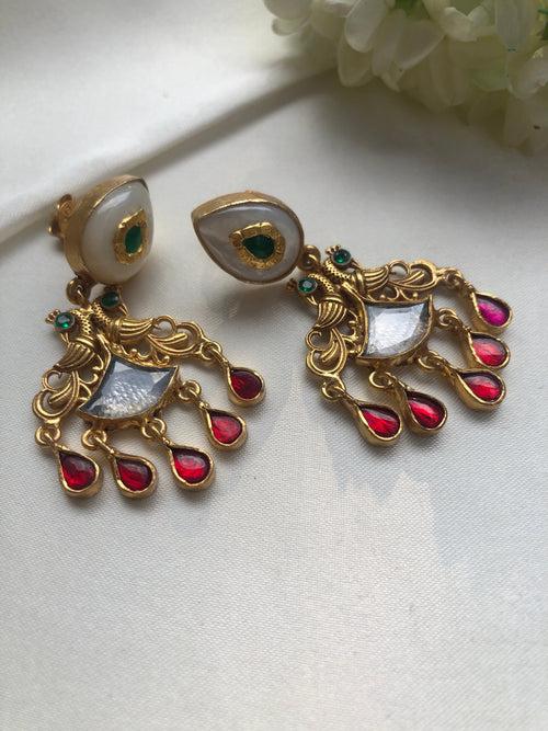 Antique polish earrings with  green kundans and ruby pearl drops