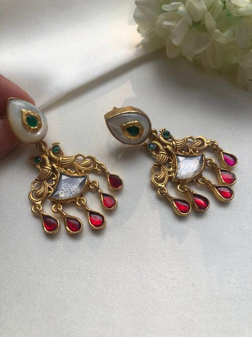 Antique polish earrings with  green kundans and ruby pearl drops