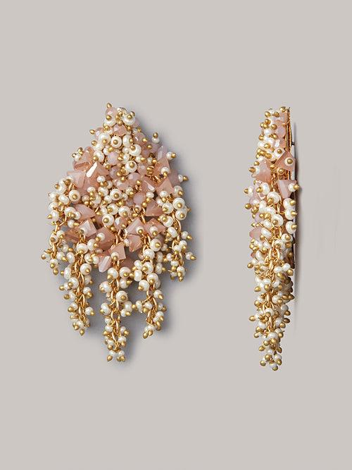 Pink And Gold Earrings On Golden Base