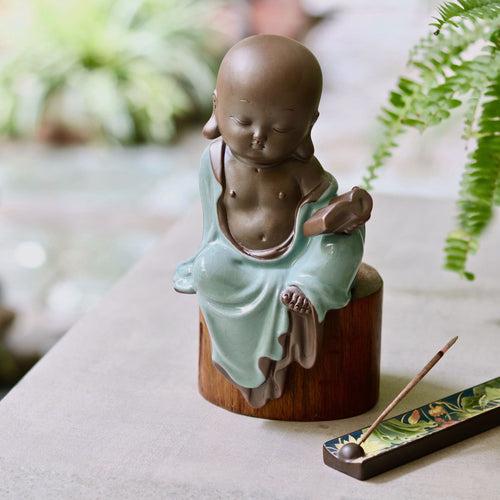 Ceramic Buddhist Monk Figurine with Book