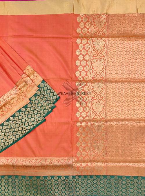 Peach Katan silk Handwoven Banarasi saree with floral skirt border