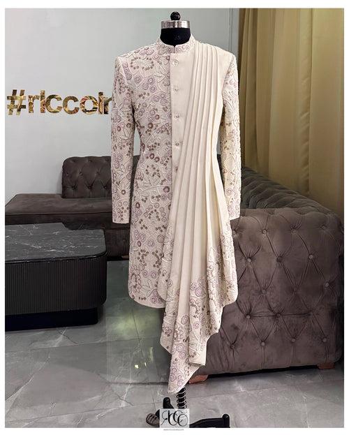 WHITE DRAPED SHERWANI WITH PINK & GREEN BEADING