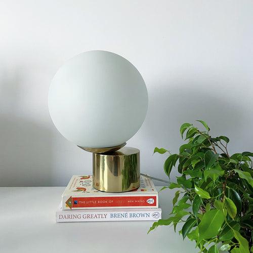 "Cliffhanger" Glass Globe and Stainless Steel Table Lamp